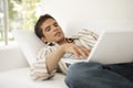 Home Tech Man on Sofa with Laptop Royalty Free Stock Photo