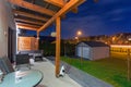 Home terrace with a roof in the night scenery Royalty Free Stock Photo