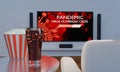 Home Theater with food and drink. Popcorn and Cola in clear glass on table. Big wall screen TV and Audio equipment use for Mini