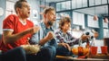 At Home Three Joyful Soccer Fans Sitting on a Couch Watch Game on TV, Tense Moment when Sports Team Royalty Free Stock Photo