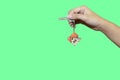 giving away home keys to people who get it.The background is Green Screen. Royalty Free Stock Photo