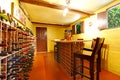 Home wine room interior with orange walls and wine.