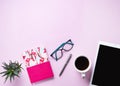 Home work. Business flat lay with cup of coffee, note, pencil, eye glasses, tablet and sicculent on pink background Royalty Free Stock Photo