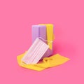 Home workout sports equipment, purple yoga block and yellow elastic bands on bright pink background. Minimal fitness lifestyle Royalty Free Stock Photo