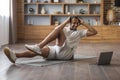 Home Workout. Sporty Black Man Training With Laptop In Living Room Interior Royalty Free Stock Photo