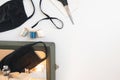 Home workplace with sewing machine,  threads of sewing protective medicine mask on white isolated background Royalty Free Stock Photo
