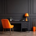 Home workplace with wooden drawer writing desk and orange chair near black wall with wainscoting Royalty Free Stock Photo