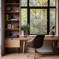 Home workplace with wooden writing desk and chair against window near bookcase. Interior design of modern home office