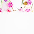 Home workspace with clipboard, diary, pink tulips and golden clips on white background. Flat lay, top view. Blogger composition. Royalty Free Stock Photo