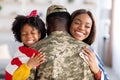 Homecoming Concept. American Soldier Embracing Wife And Daughter After Returning From Army Royalty Free Stock Photo