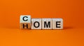 Homecoming concept. Turned a cube and changed the word `come` to `home`. Beautiful orange background. Business concept. Copy s