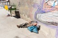 Homeless barefoot lying sleeping street, la Paz, Bolivia.