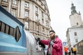 Homeless beggar near the trash containers in the city Royalty Free Stock Photo