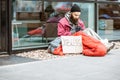 Homeless begging money near the business center Royalty Free Stock Photo