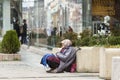 Homeless begging woman