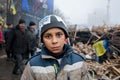 Homeless boy play on the cold street Royalty Free Stock Photo