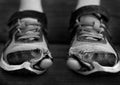 Homeless Child Wearing Old Worn Out Shoes with Holes in them Toes Sticking Out Royalty Free Stock Photo