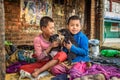 Homeless children playing with puppies in Kathmandu, Nepal