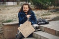 Homeless man in a durty clothes autumn city Royalty Free Stock Photo