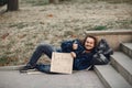 Homeless man in a durty clothes autumn city Royalty Free Stock Photo