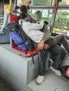 Homeless couple in public transport, sleeping