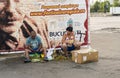 Homeless couple selling raw wallnuts on the streets