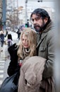 Homeless couple struggle city centre Royalty Free Stock Photo