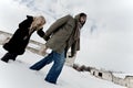 Homeless couple struggle in winter Royalty Free Stock Photo