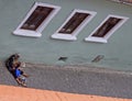 Homeless, dirty woman and her son are liying on street asphalt in Sibiu, Romania