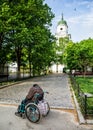 Homeless disabled man in a wheelchair