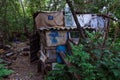 Homeless dweling. Small habitation made from garbage in dirty littered forest