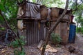 Homeless dwelling. Small habitation made from garbage in dirty littered forest Royalty Free Stock Photo