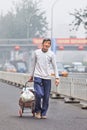 Homeless elderly in smog blanketed city, beijing, China