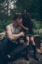 Homeless father and daughter sit on the garbage dump Royalty Free Stock Photo