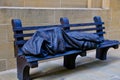 Homeless Figure Under Blanket on Park Bench, Modern Sculpture