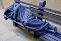 Homeless Figure Under Blanket on Park Bench, Modern Sculpture Royalty Free Stock Photo