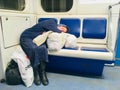 Homeless lady sleeping on a train