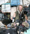 Homeless man with cat and dogs