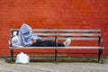 Homeless man at Coney Island Boardwalk in Brooklyn Royalty Free Stock Photo