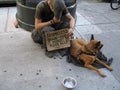 Homeless Man with Dog Royalty Free Stock Photo