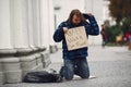 Homeless man in a durty clothes autumn city Royalty Free Stock Photo