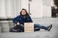 Homeless man in a durty clothes autumn city Royalty Free Stock Photo