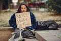 Homeless man in a durty clothes autumn city Royalty Free Stock Photo