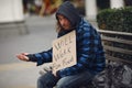 Homeless man in a durty clothes autumn city Royalty Free Stock Photo