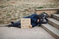 Homeless man in a durty clothes autumn city Royalty Free Stock Photo