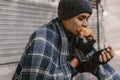 Homeless man eating sandwich on the street Royalty Free Stock Photo