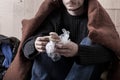 Homeless man eating sandwich Royalty Free Stock Photo