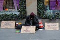 Homeless man in front of Sacks Fifth Avenue store in Midtown Manhattan