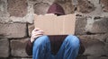 Homeless man holding blank cardboard Royalty Free Stock Photo