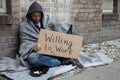 Homeless Man Holding Cardboard With Text Willing To Work